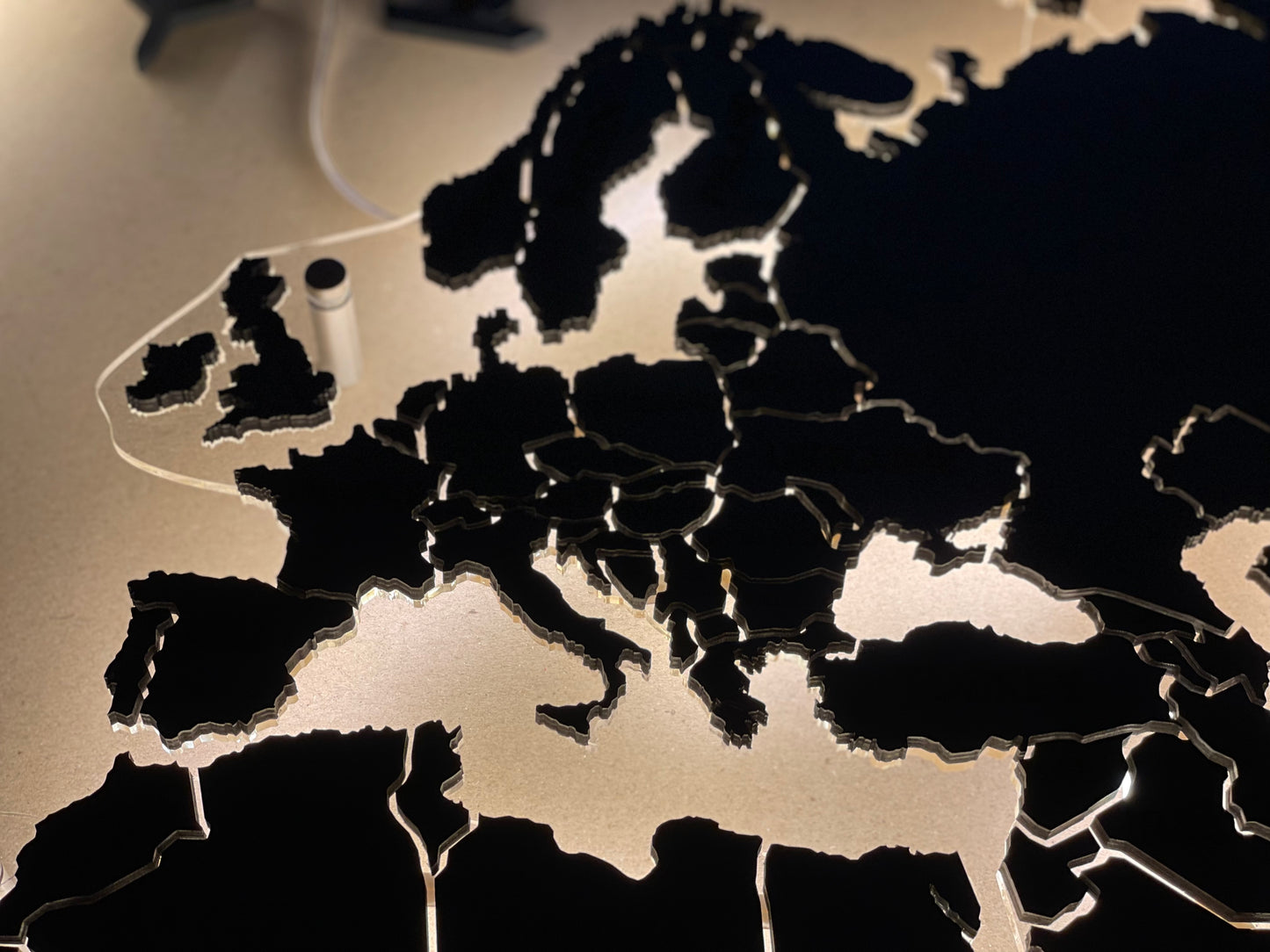 LED world map on acrylic glass with LED lighting between countries color Nero