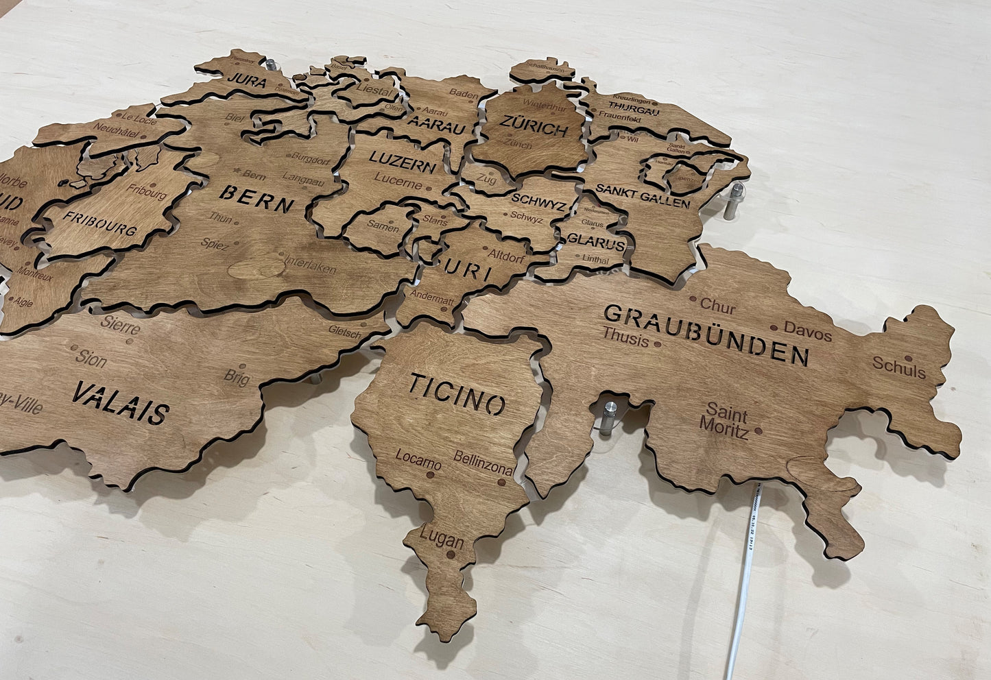 Switzerland  LED map on acrylic glass with backlighting between regions color Rosewood